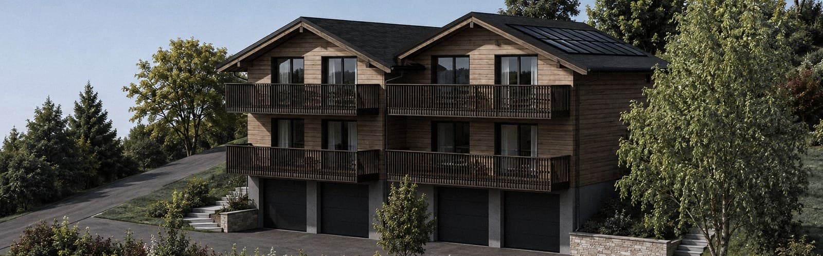 Il progetto visto da sud-ovest: i due chalet contigui, quattro appartamenti riconoscibili sulla facciata, balconi continui e quattro porte di garage nello zoccolo.